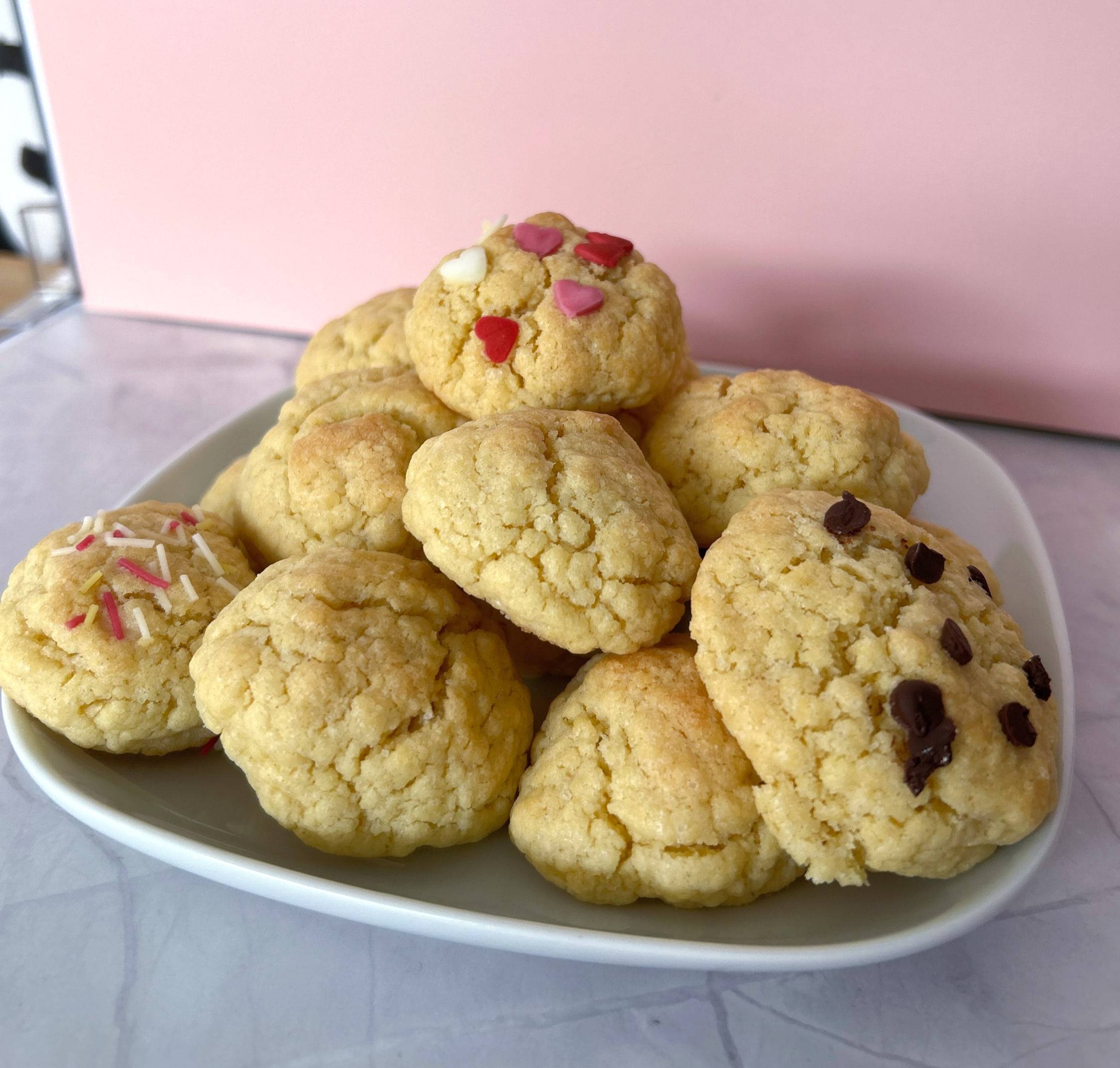 A plate of cookies studded with chocolate and pink hearts